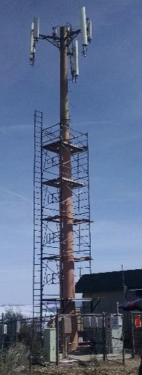 Mono-pole cell phone tower being strengthened with PileMedic FRP laminate