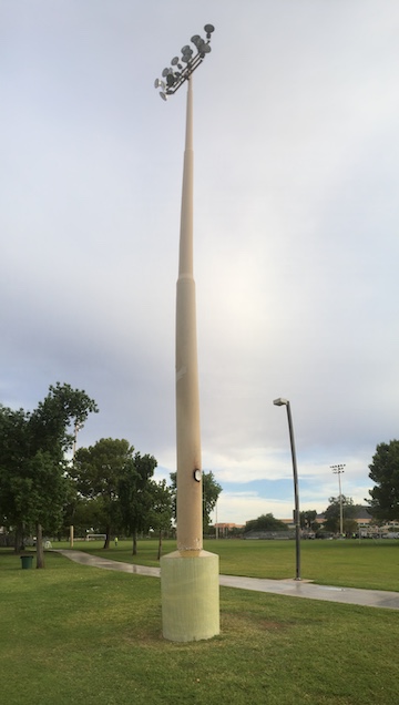 Steel light pole damaged by corrosion at the base strengthened with PileMedic FRP laminates