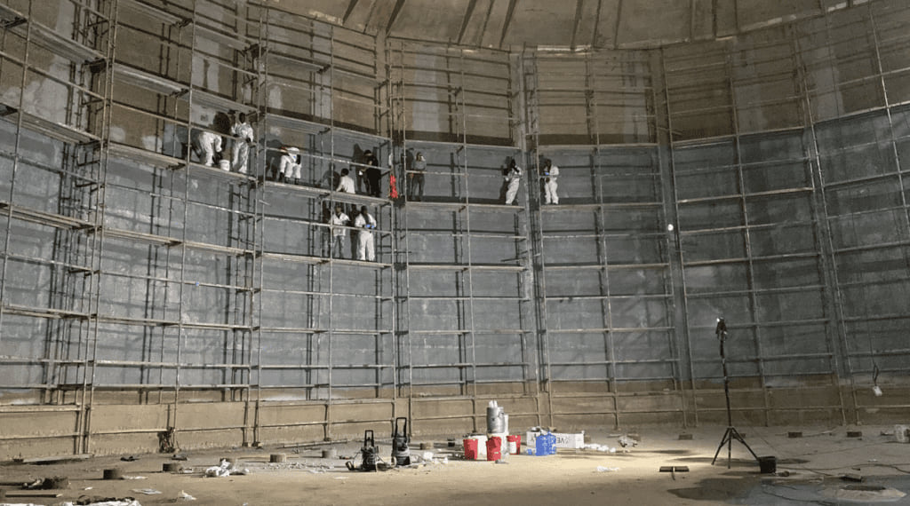 Leaking liquid storage tank repaired with FRP fabric from inside