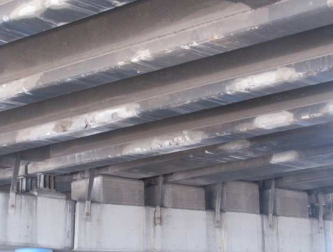 Fig. 3. Damage to 19th Ave. bridge girders from numerous collisions.