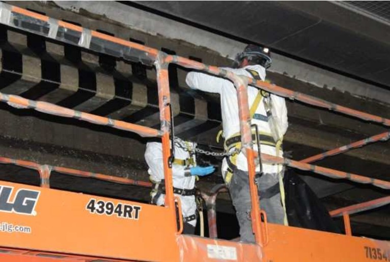 Fig. 8. Installation of CFRP strips on the 11 girders at the 19th Ave. bridge.